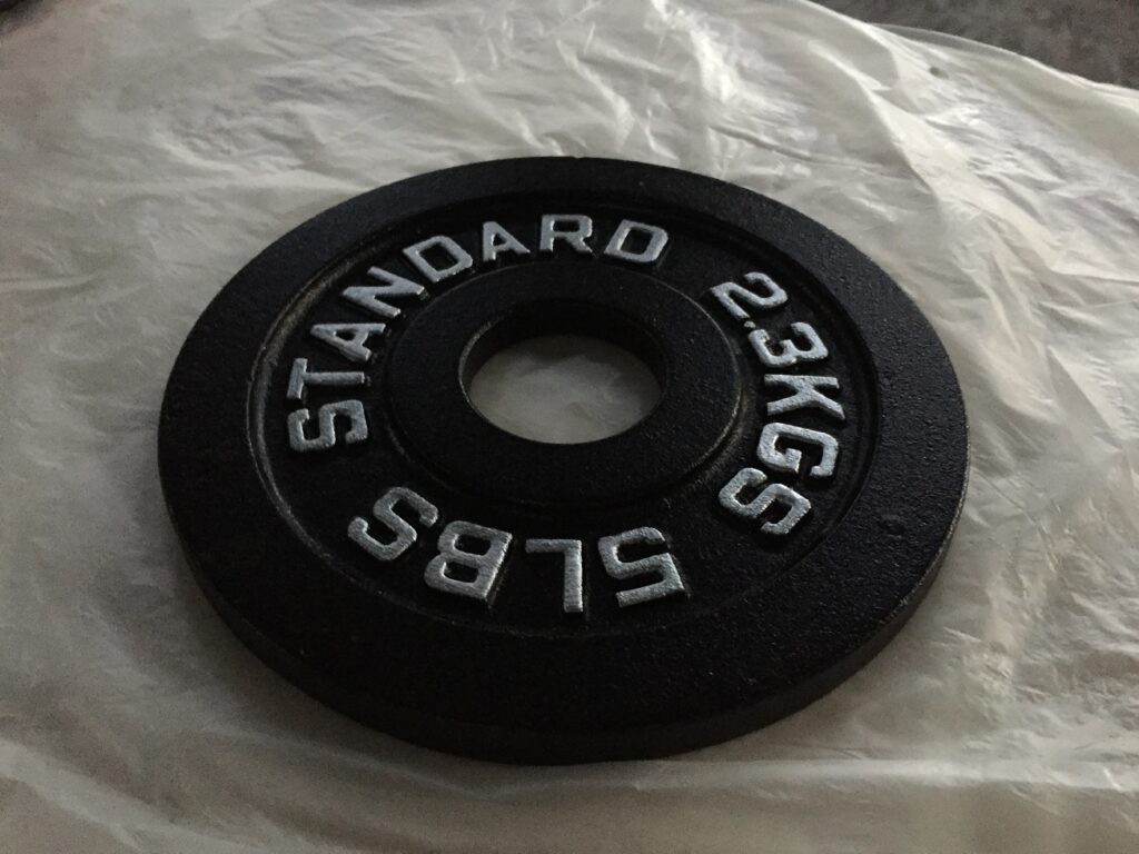 Standard black painted cast iron barbell weight plates